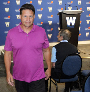 What the hell is with that shirt? I'm pretty sure it's not breast cancer awareness week in the CFL. Doesn't management usually wear a team issued polo or something to press conferences? I mean they must get them for free. The rest of us pay our of our noses for them. The Bomber Store is literally in the same building. He had to have chosen to wear that all on his own. I don't think this is a good omen.